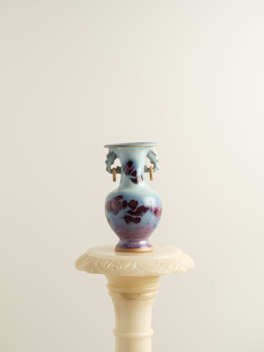 Small Jun-style vase with blue and purple glaze and twin ring handles.