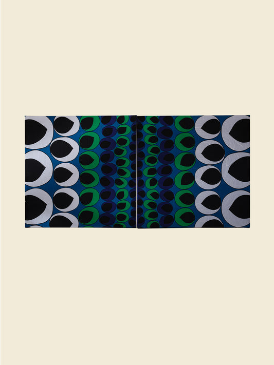 Peacock Rhythm Diptych, a set of two textile artworks with bold circular patterns in blue, green, black, and white, mounted on stretcher frames.
