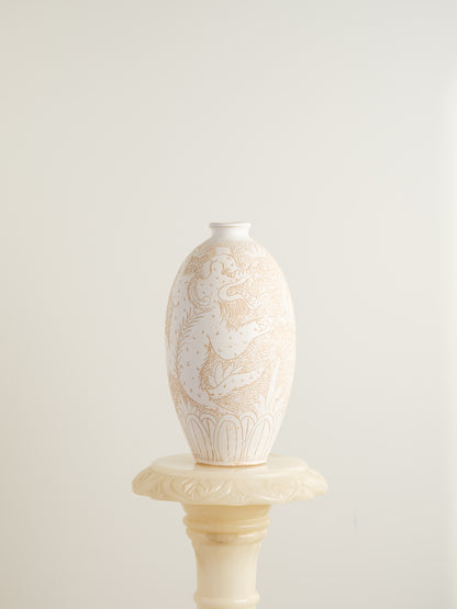 Sgraffito ceramic vase titled Qilin Whisper, featuring an ivory surface etched with a mythological qilin design in soft beige tones.