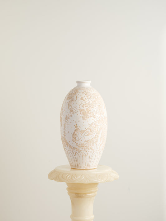 Sgraffito ceramic vase titled Qilin Whisper, featuring an ivory surface etched with a mythological qilin design in soft beige tones.