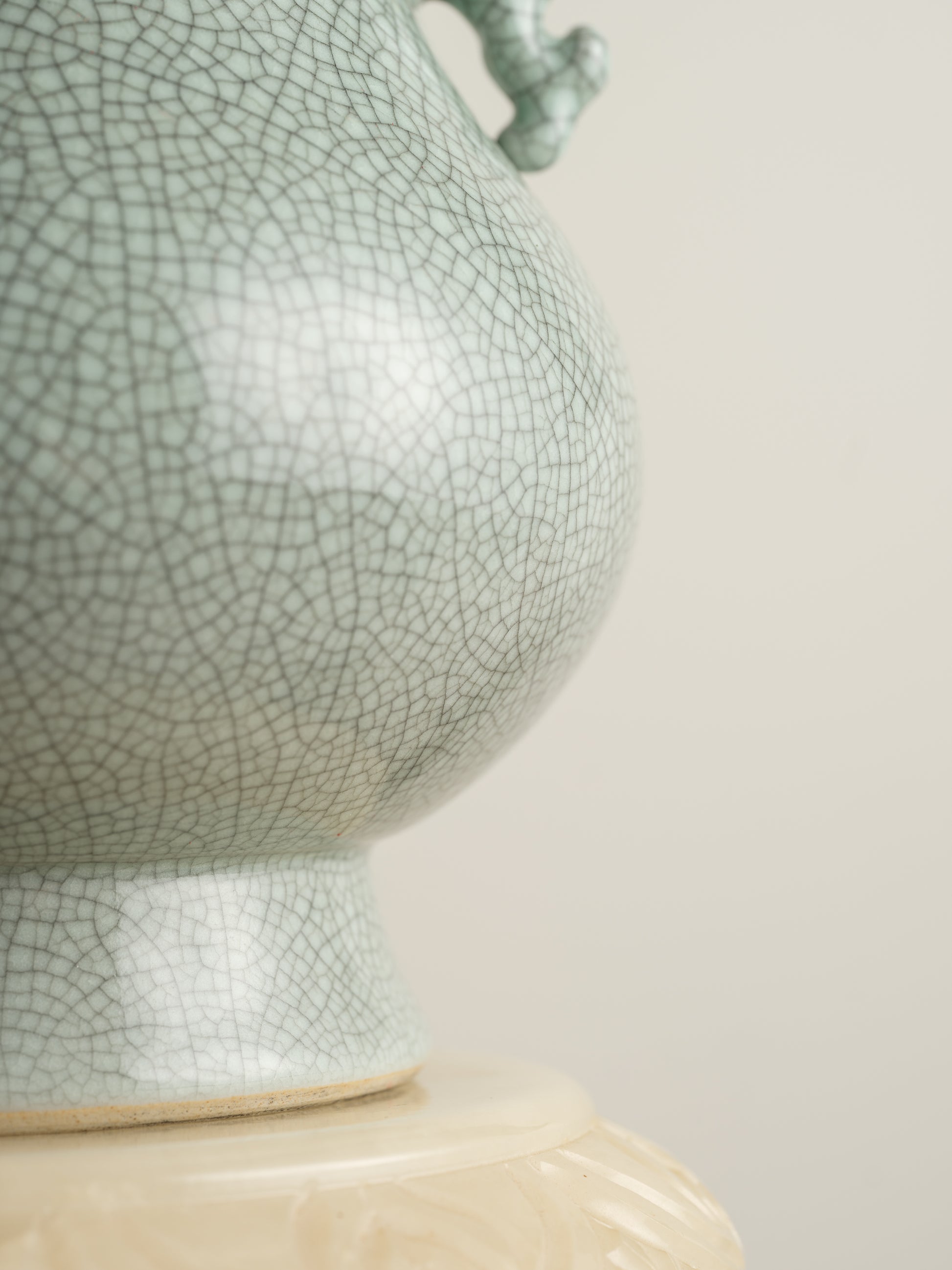 Song Mist Celadon Hu Vase, featuring a pale green crackle glaze with ornate side handles and a traditional hu form.