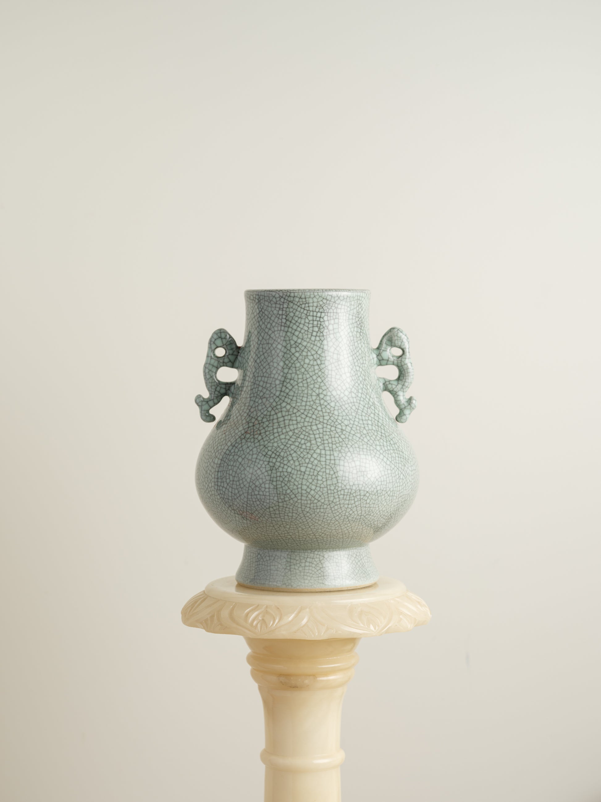 Song Mist Celadon Hu Vase, featuring a pale green crackle glaze with ornate side handles and a traditional hu form.