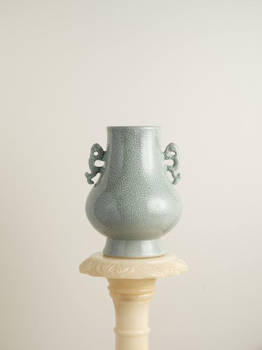 Song Mist Celadon Hu Vase, featuring a pale green crackle glaze with ornate side handles and a traditional hu form.