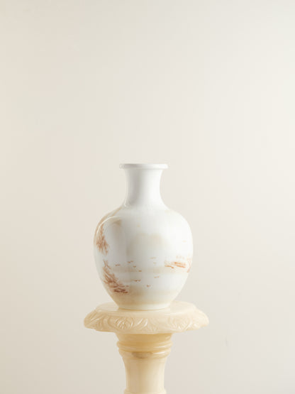 Porcelain vase with tea-wash glaze and hand-painted sepia landscape scene of mountains and flying birds.