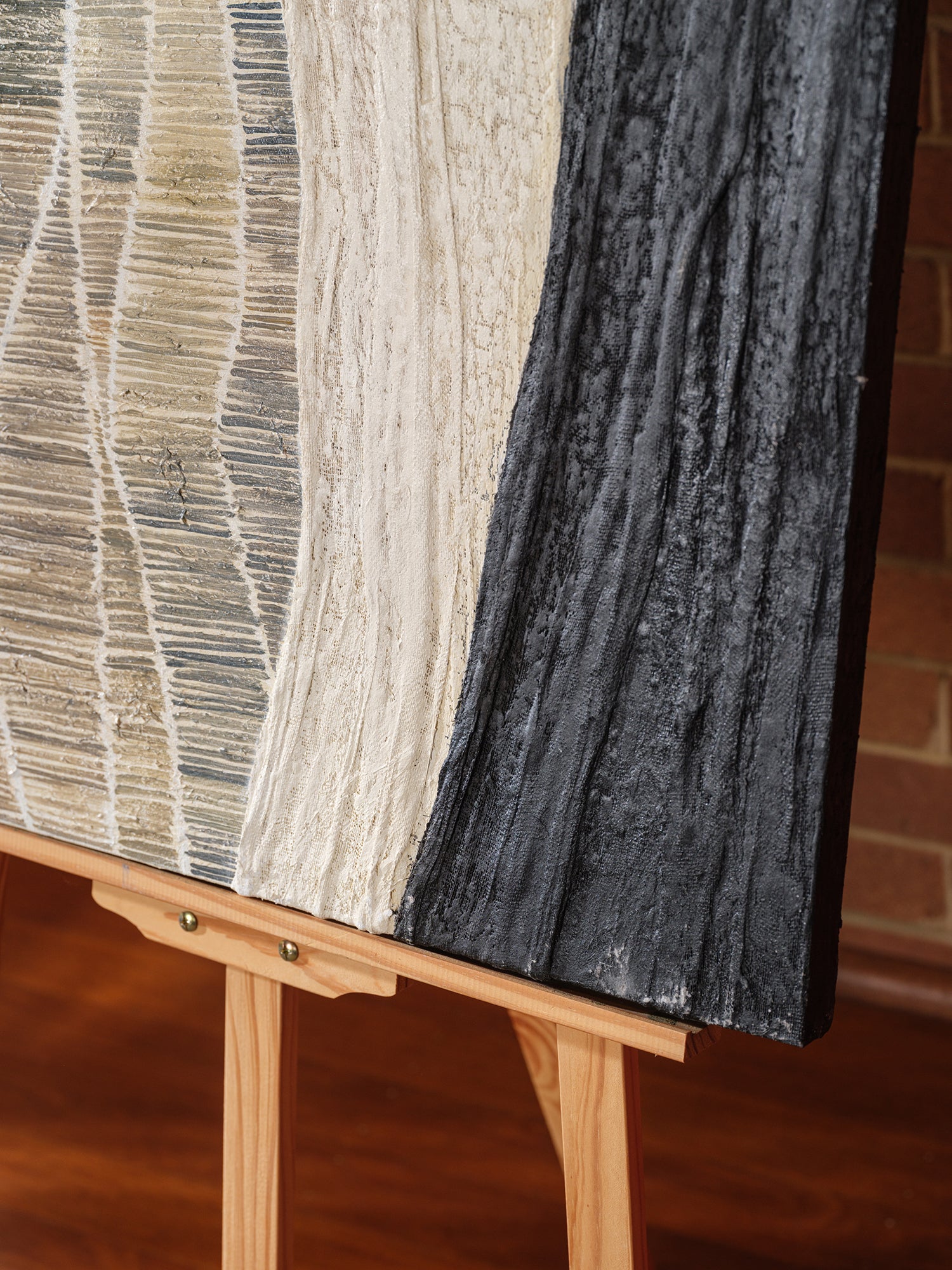 Abstract textured painting titled Tidal Strata I, featuring layered vertical bands in beige, cream, and charcoal tones on canvas.