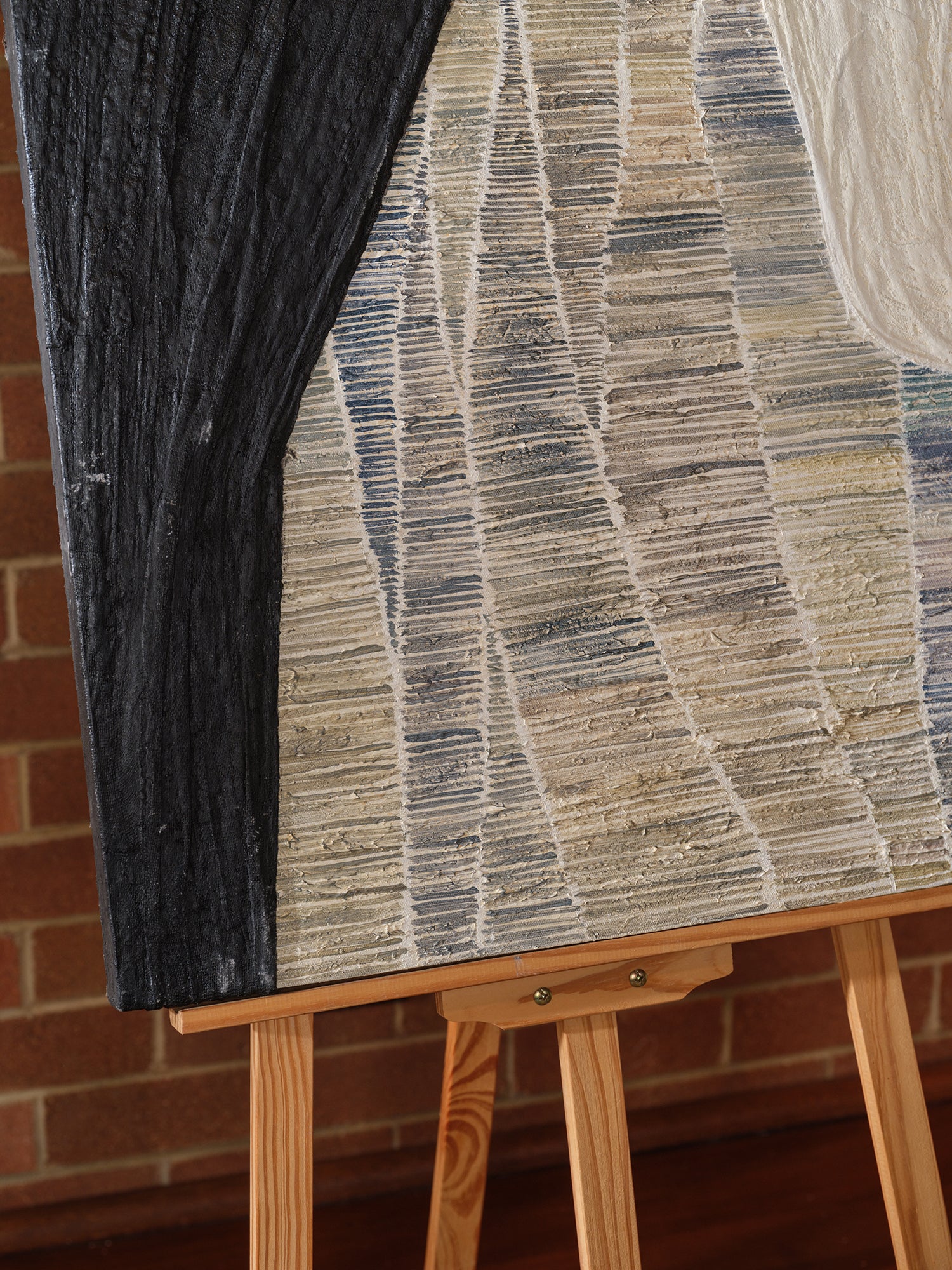 Abstract textured painting titled Tidal Strata II, featuring layered vertical bands in cream, beige, and charcoal tones on canvas.
