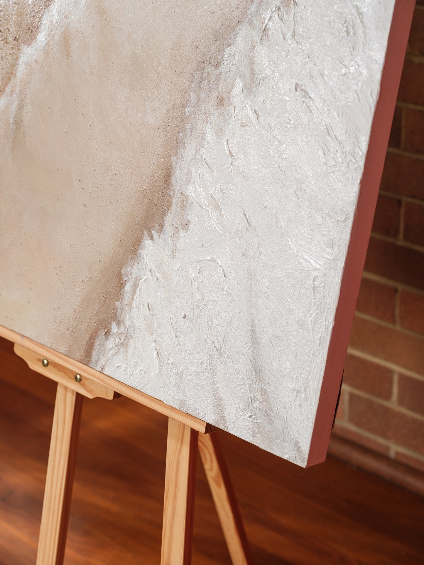 Abstract textured painting titled Tideworn Dune, featuring layered sandy beige and white tones evoking coastal dunes on canvas.