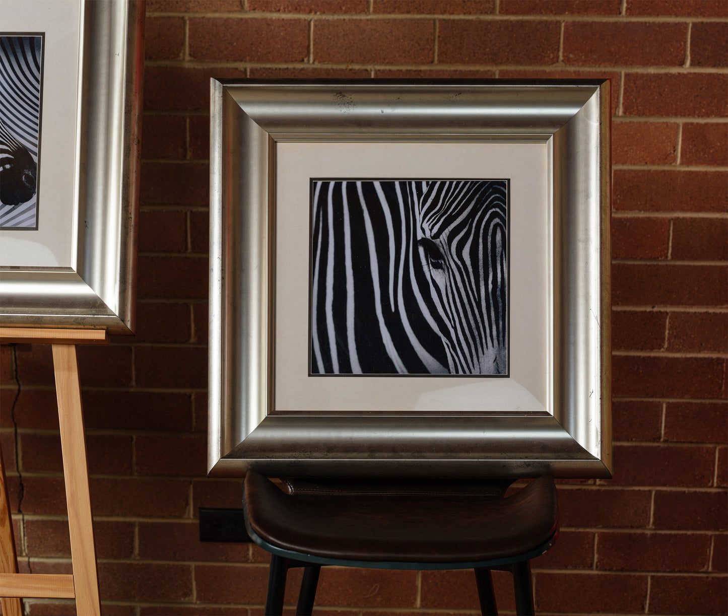 Fine art prints titled Zebra Pair, featuring two framed black and white zebra portraits with bold stripes, sold together as a pair.