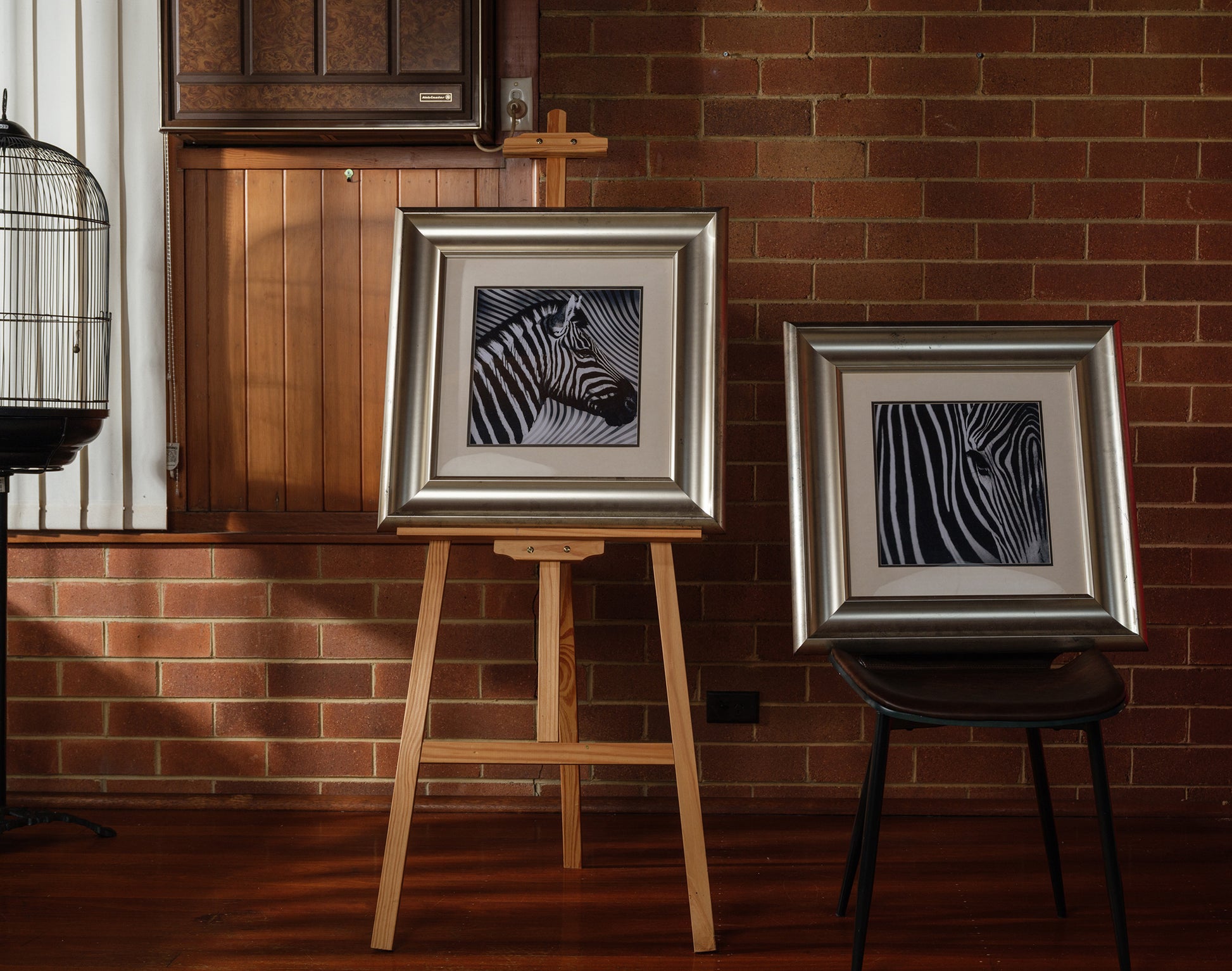 Fine art prints titled Zebra Pair, featuring two framed black and white zebra portraits with bold stripes, sold together as a pair.